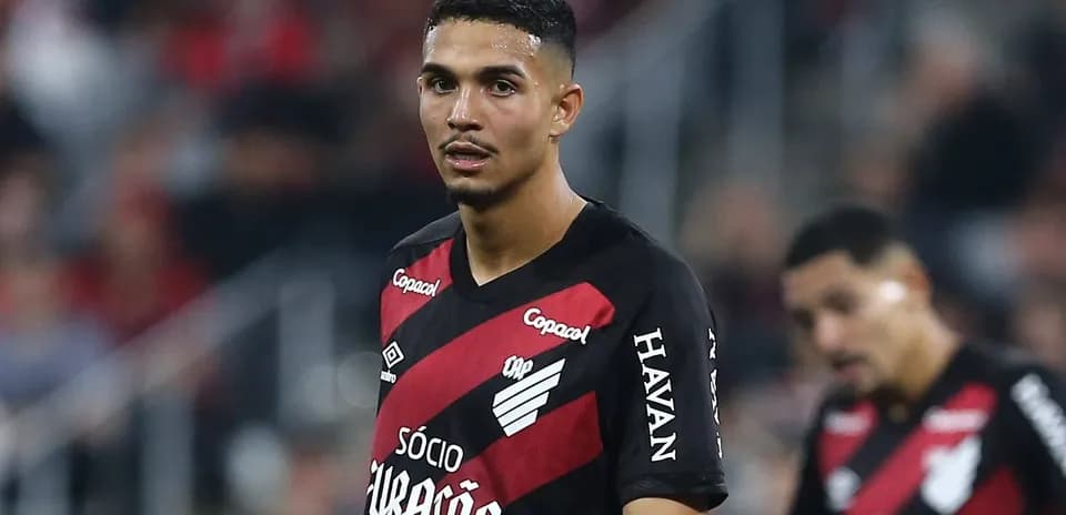 Player in black and red jersey during match