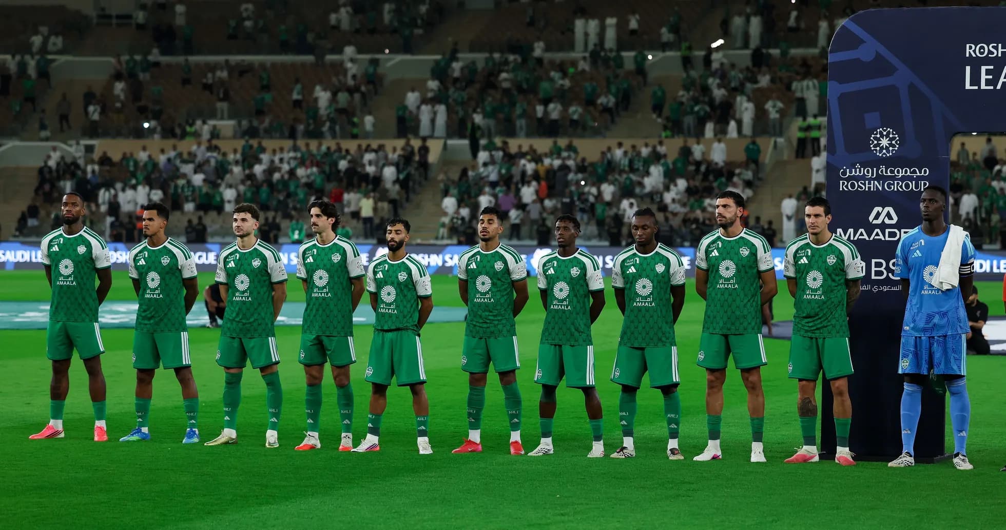 Football team lined up before a match on the field