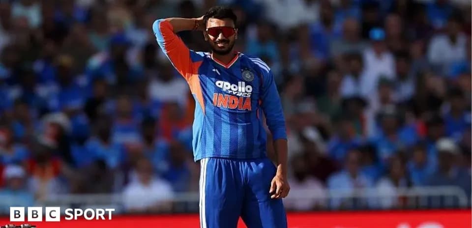 Cricketer in India jersey signaling during match