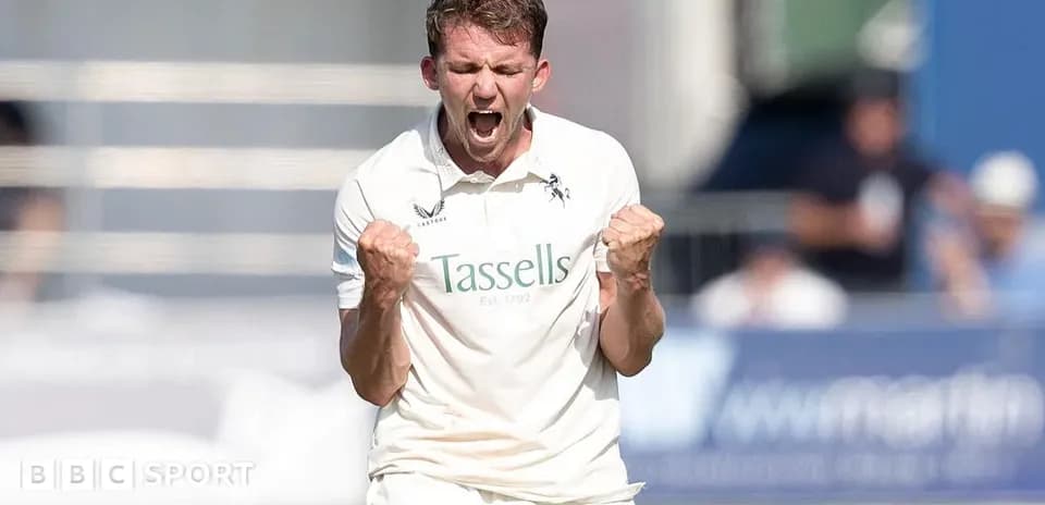 Cricketer celebrating a wicket with clenched fists