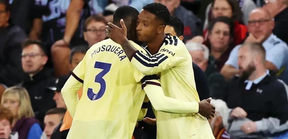 Two players embracing during a match celebration