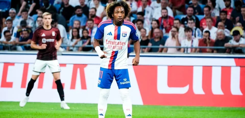 Player in Lyon kit during match with spectators