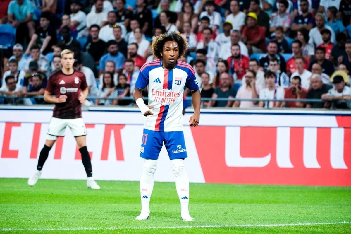 Player in Lyon kit during match with spectators