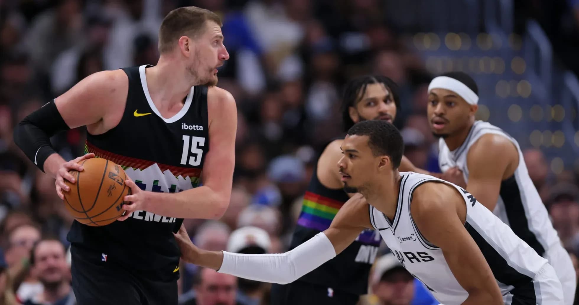 Player dribbling ball while being guarded during game