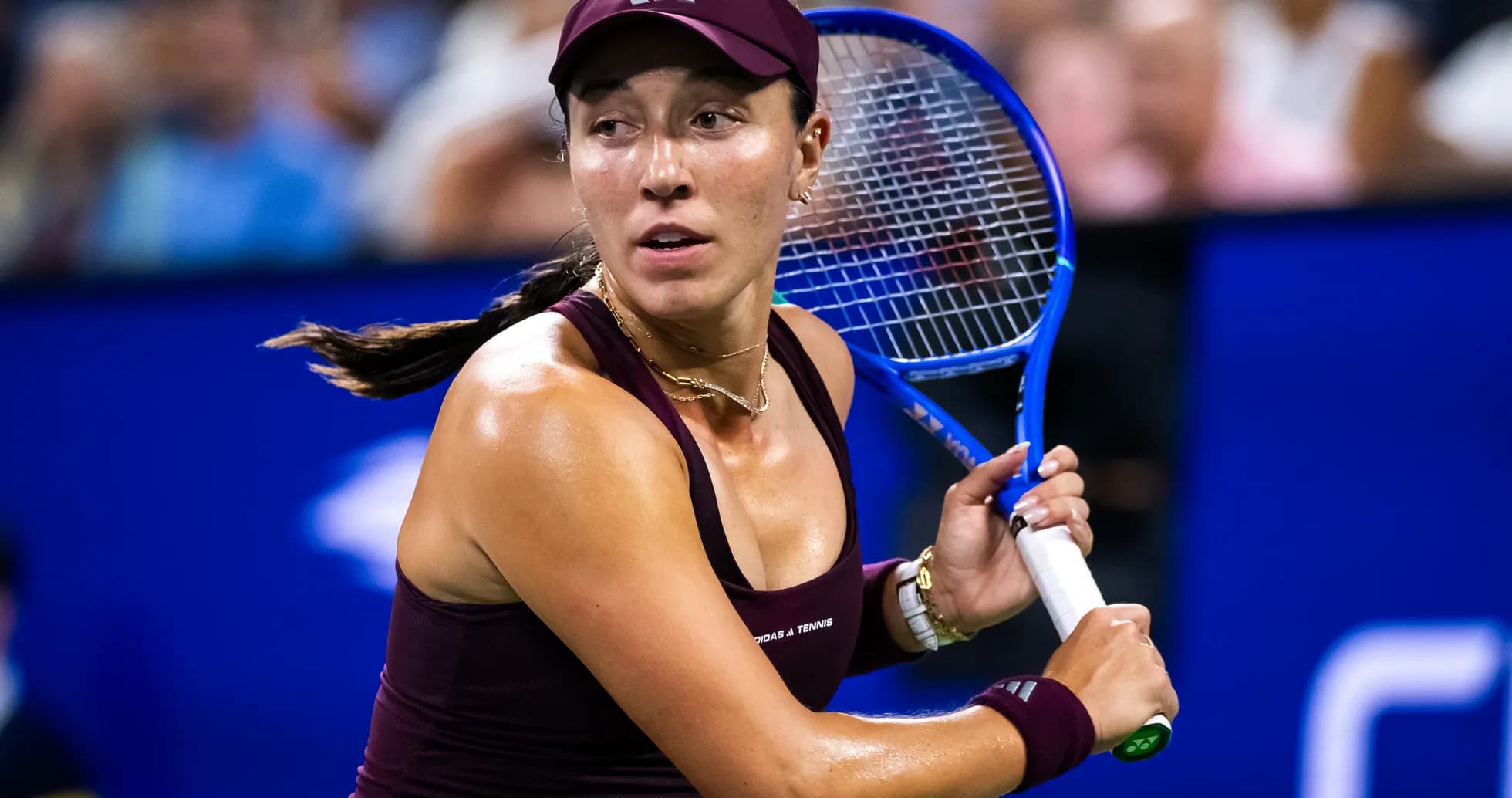 Female tennis player preparing to hit the ball