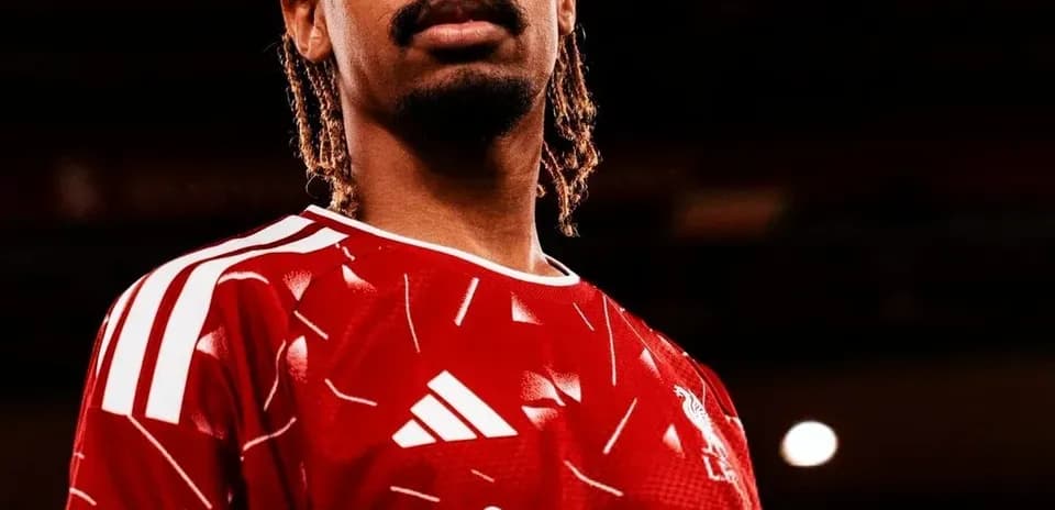 Player wearing red jersey with club logo