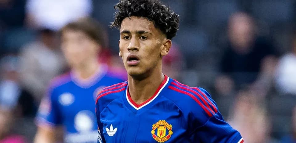 Young player wearing Manchester United jersey on field