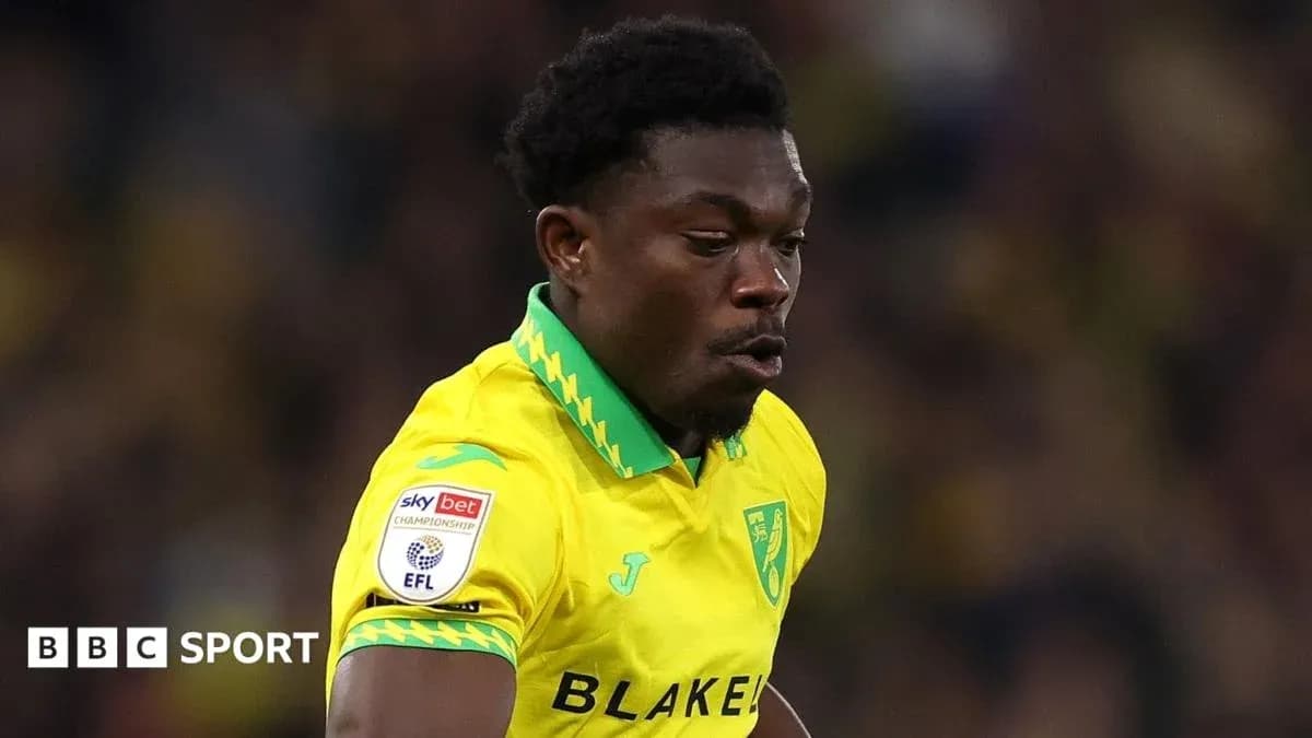Player in yellow kit during a football match