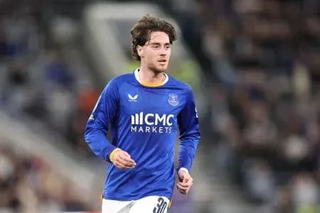 Player running on the field in blue jersey