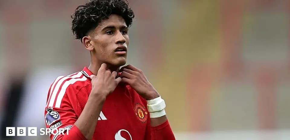 Player adjusting collar during match in red kit