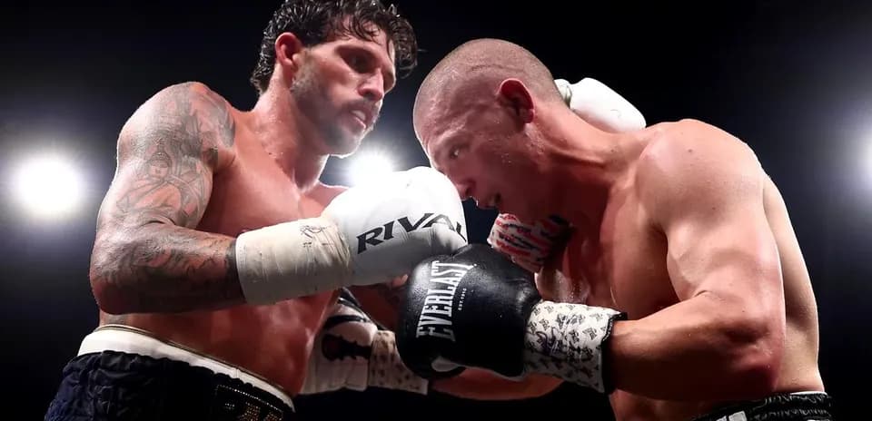 Two boxers exchanging punches in the ring