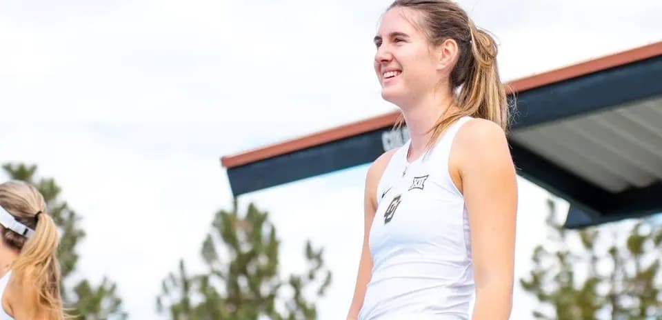 Tennis player smiling on court during event