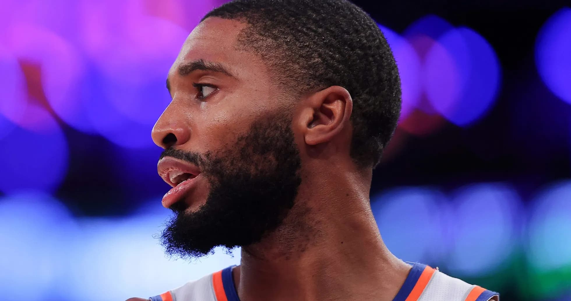 Basketball player in profile during game action