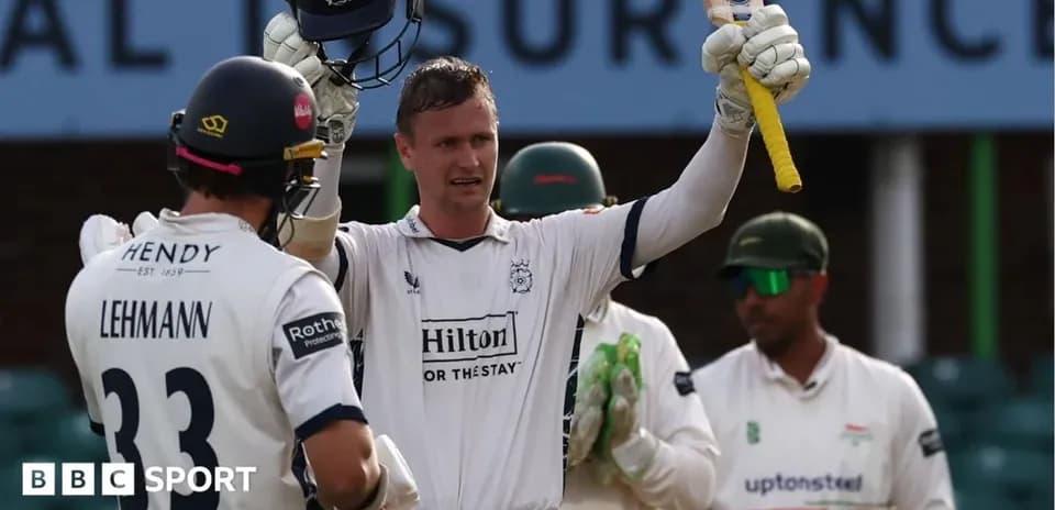 Batsman celebrating after scoring a century in cricket