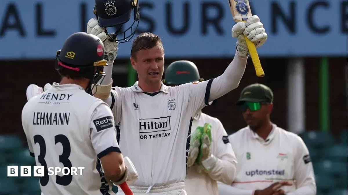 Batsman celebrating after scoring a century in cricket