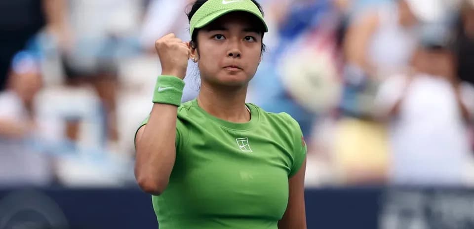 Tennis player celebrating victory with raised fist