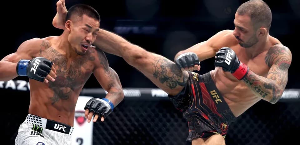 Two fighters exchanging strikes in UFC match