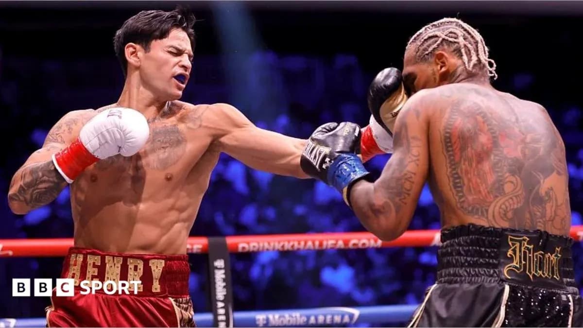 Boxer throwing punch during match in ring