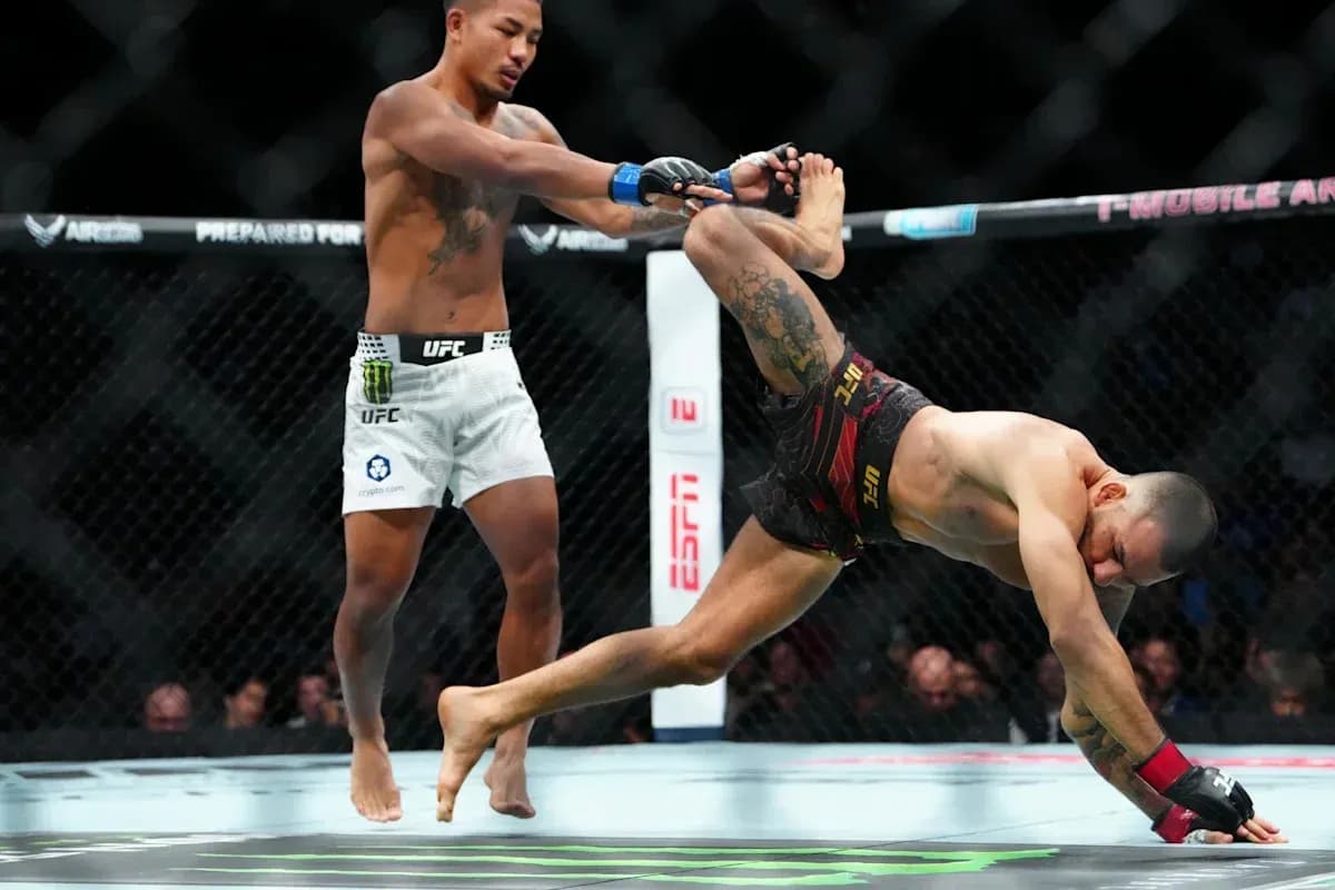 Fighter attempting takedown in UFC match