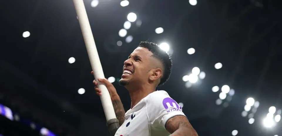 Player celebrating with a pole at stadium