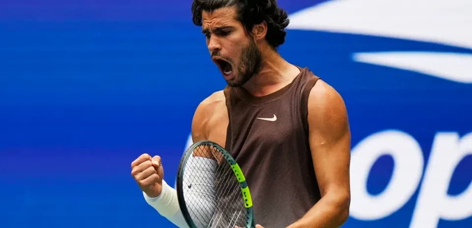 Tennis player celebrating after winning a point