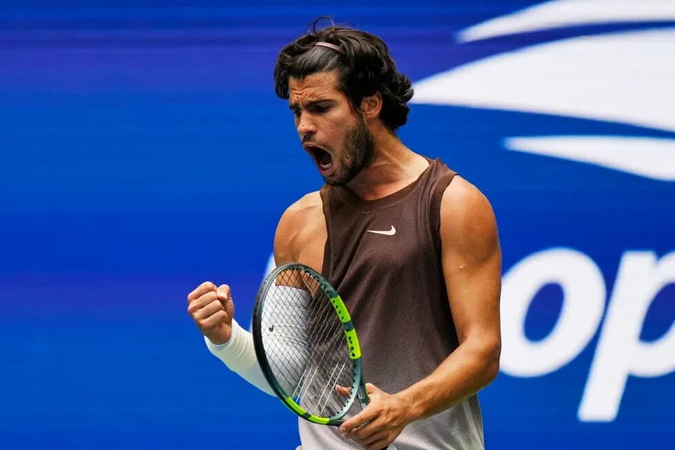 Tennis player celebrating after winning a point