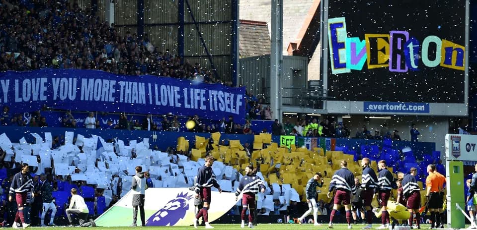 Everton fans displaying banners before the match