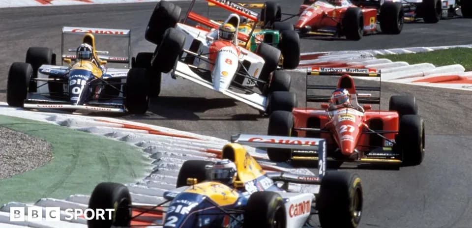Several Formula 1 cars racing on a track