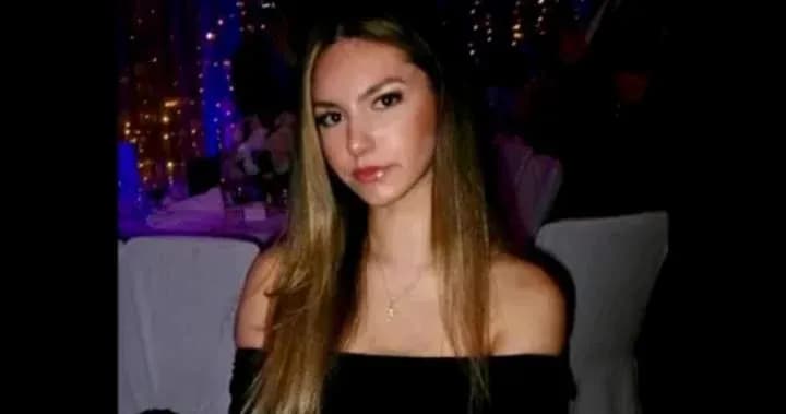 Young woman seated at a festive event