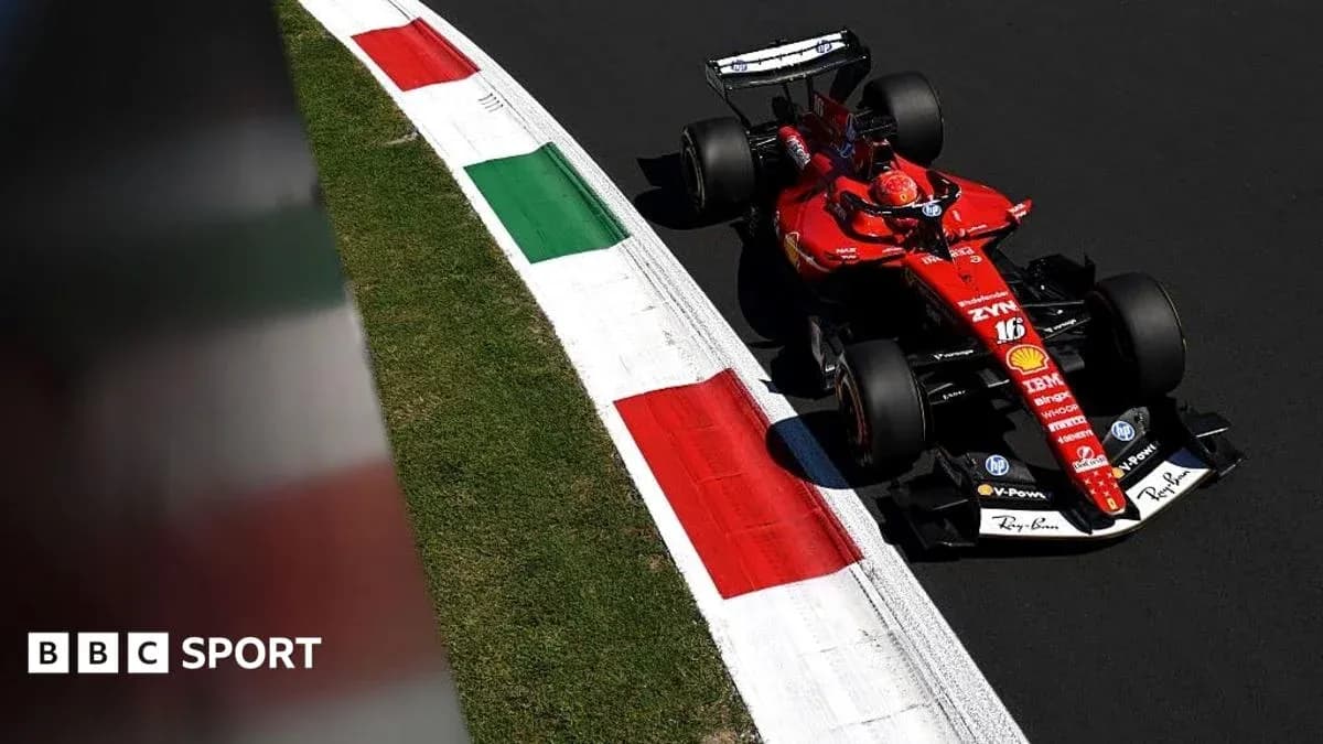 Ferrari F1 car navigating a corner on track