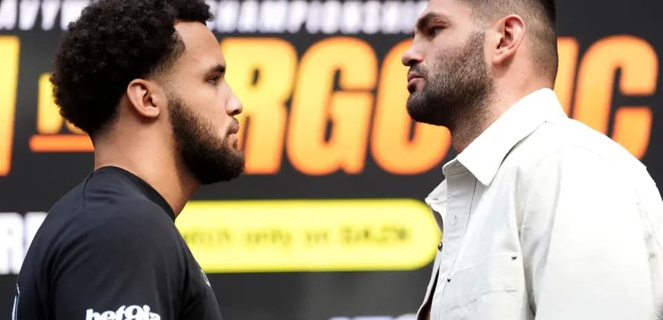 Two boxers facing off during pre-fight event