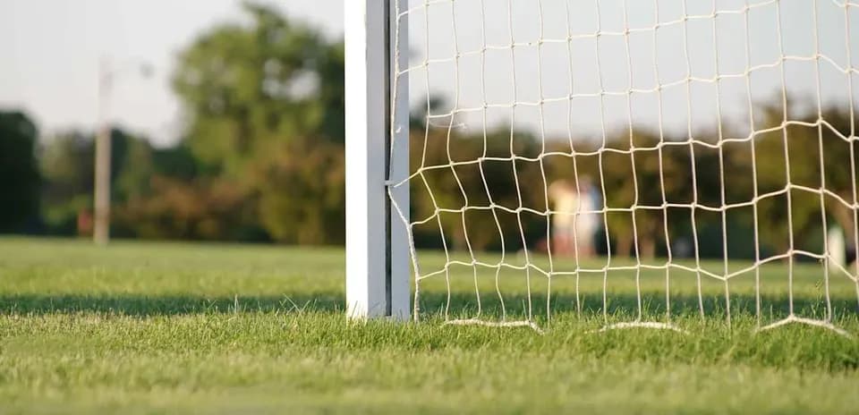 Close-up of a soccer goalpost and net