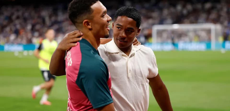Two young men sharing a moment on the pitch