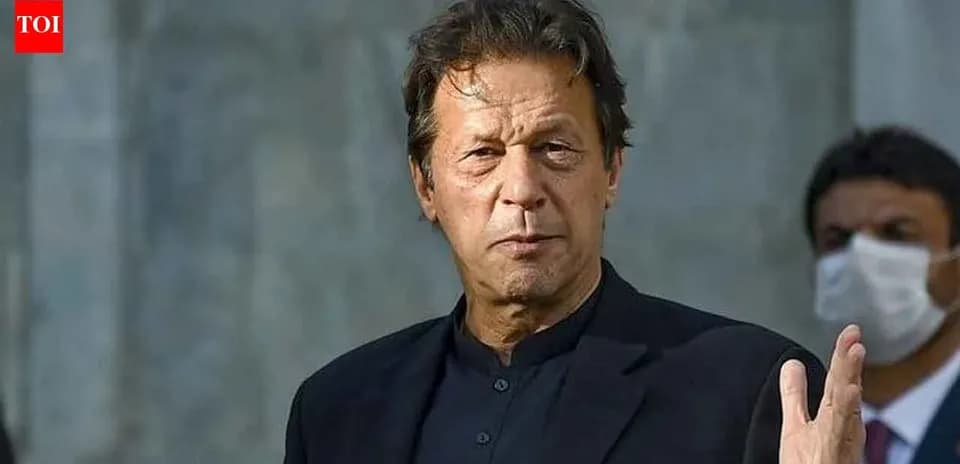 Man in black suit gesturing during a speech
