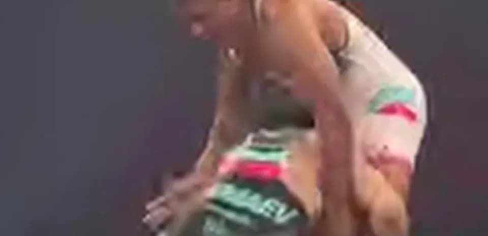 Two wrestlers competing in an intense match