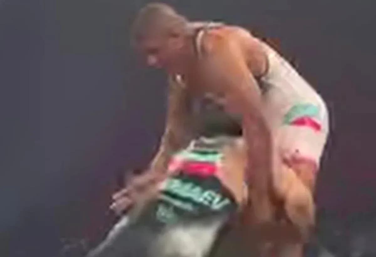 Two wrestlers competing in an intense match