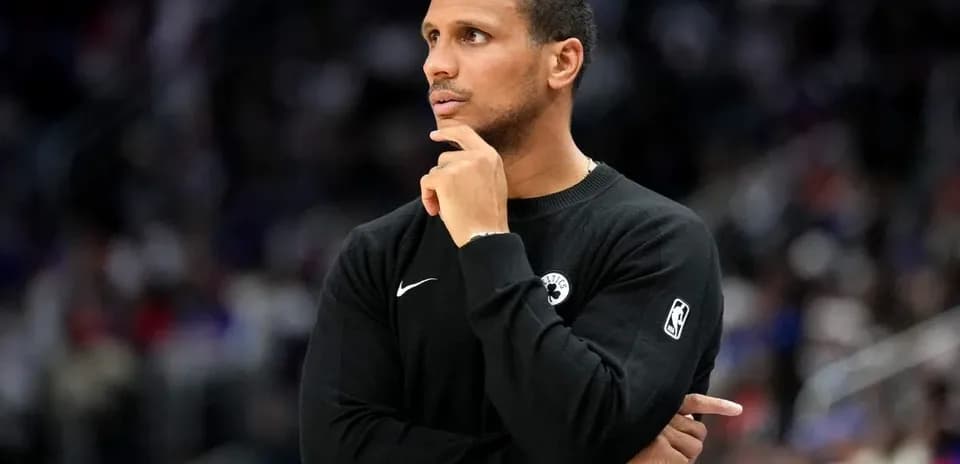 Coach observing the game with arms crossed