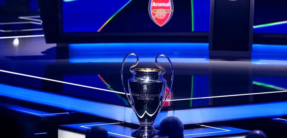 UEFA Champions League trophy displayed on stage