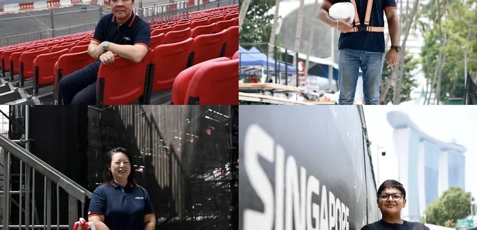 Four individuals in work attire at event venue