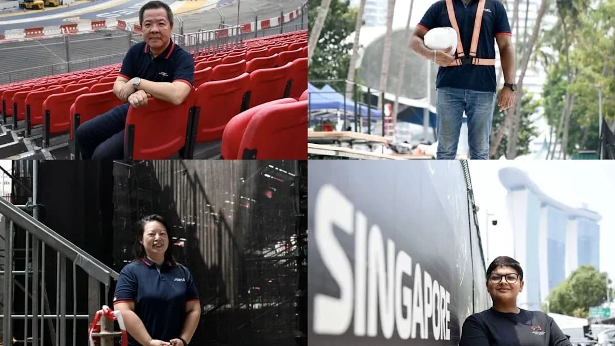 Four individuals in work attire at event venue