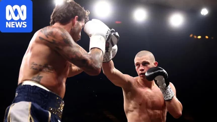 Two boxers exchanging punches in the ring