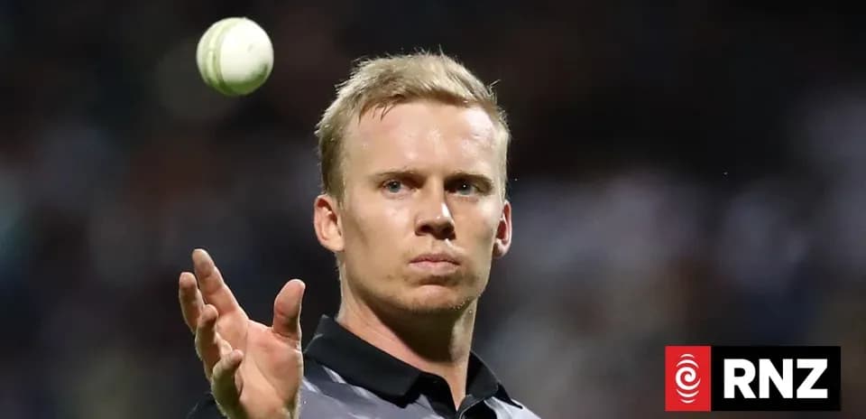 Umpire preparing to deliver a cricket ball