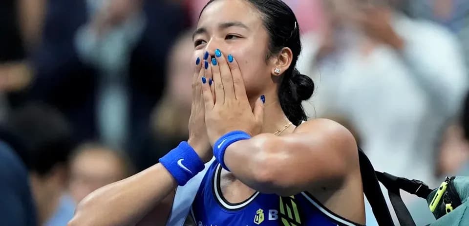 Tennis player celebrating victory with hands on face