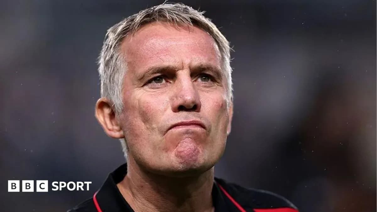 Coach with a serious expression during match