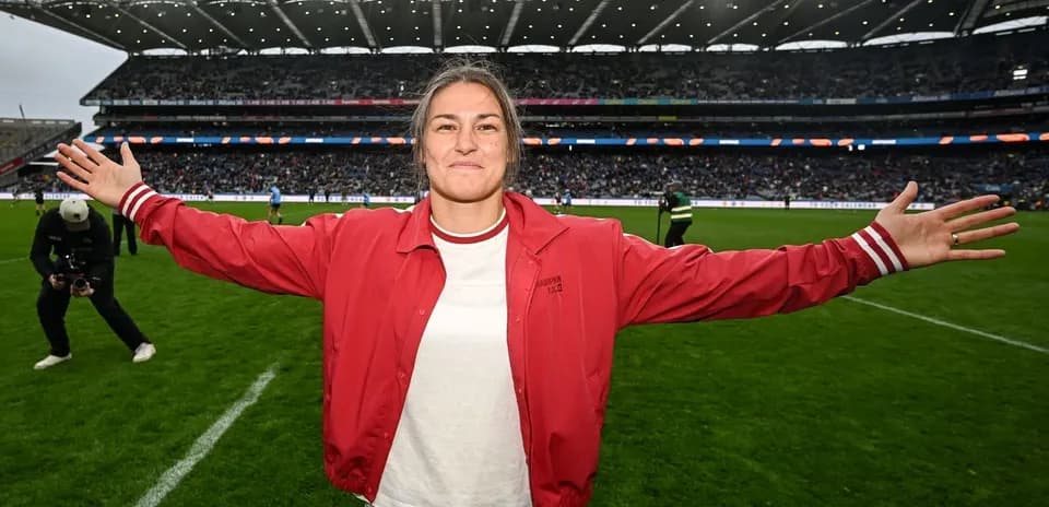 Player celebrating on the field with outstretched arms