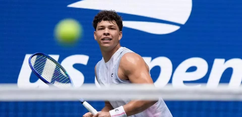 Player preparing to hit a tennis ball at US Open
