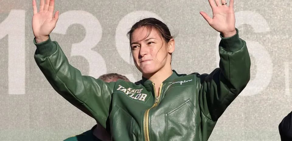 Boxer waving to crowd during public appearance
