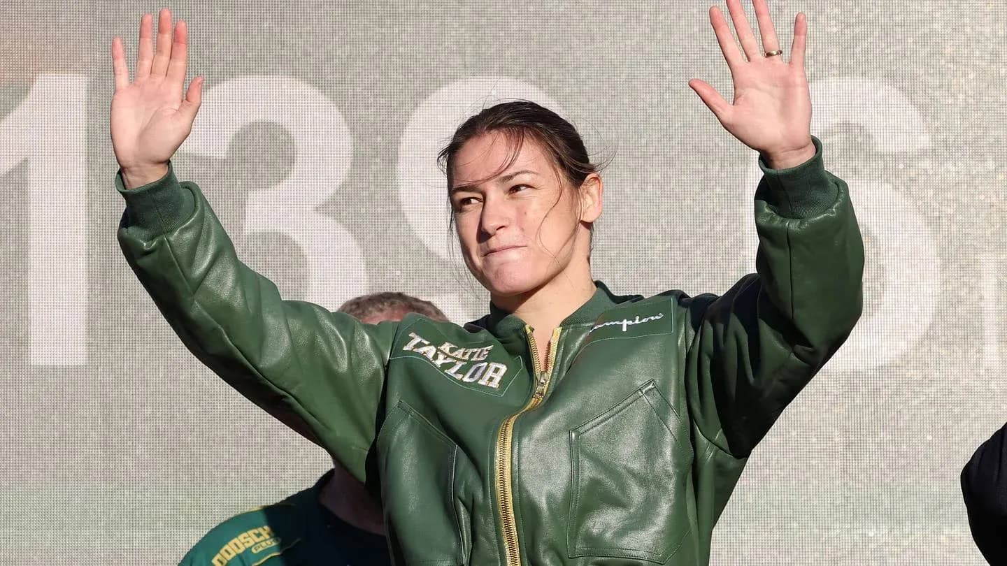 Boxer waving to crowd during public appearance