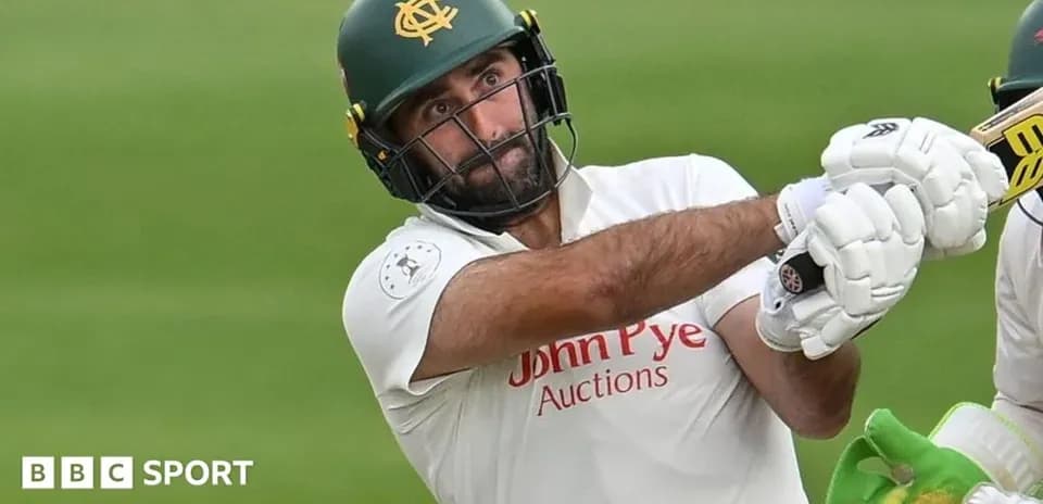 Batsman playing a shot during cricket match