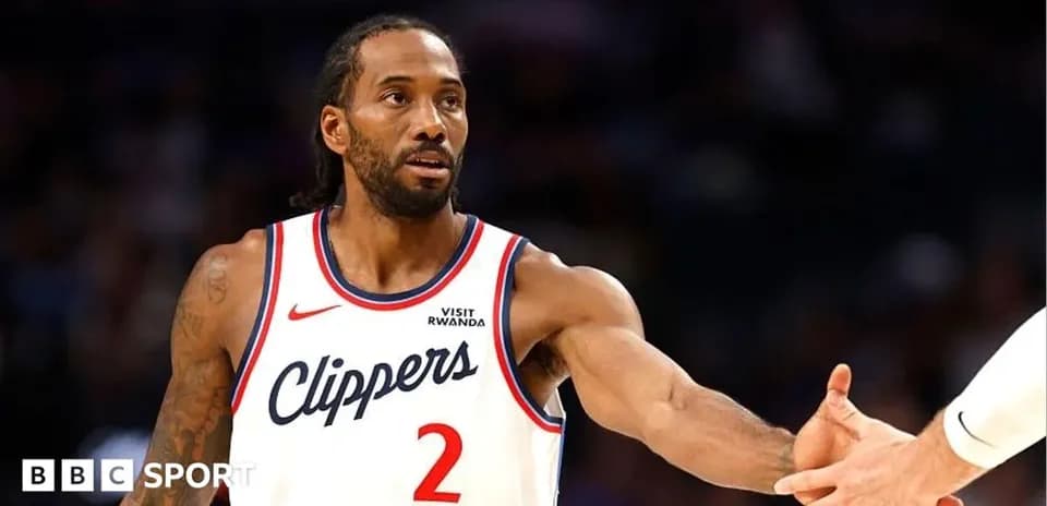 Player in Clippers jersey reaching for handshake